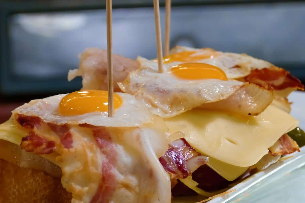 A pintxo made with eggs, Serrano ham, cheese, and bread