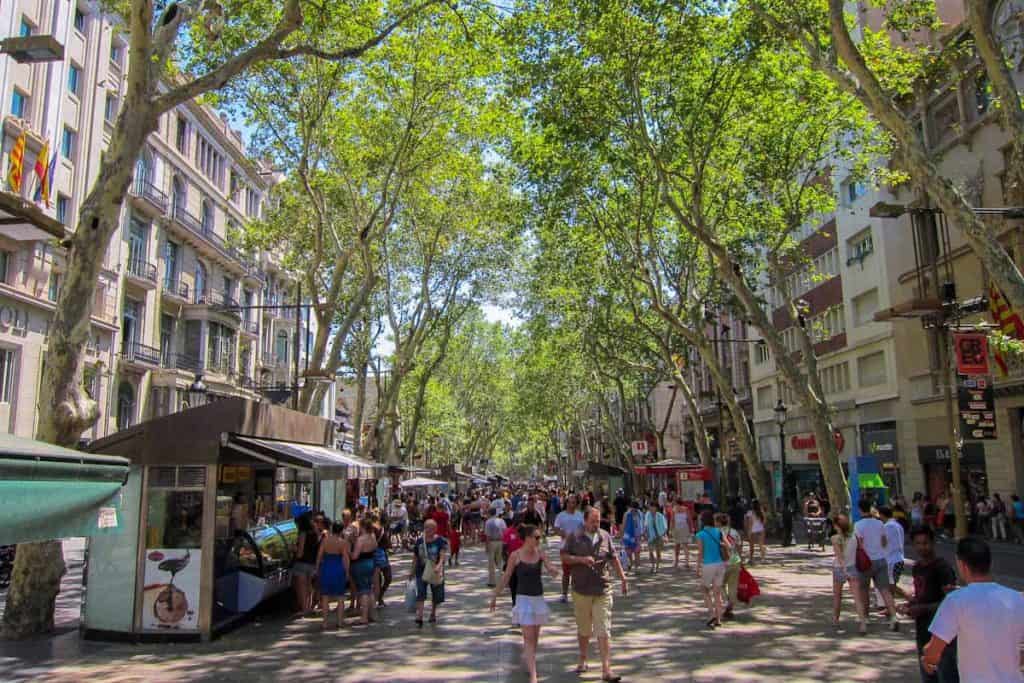 People strolling in Les Rambles, one of Barcelona's streets and squares that most travellers visit