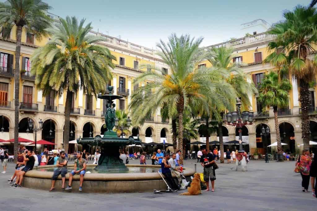 People sitting in the Plaça Reial