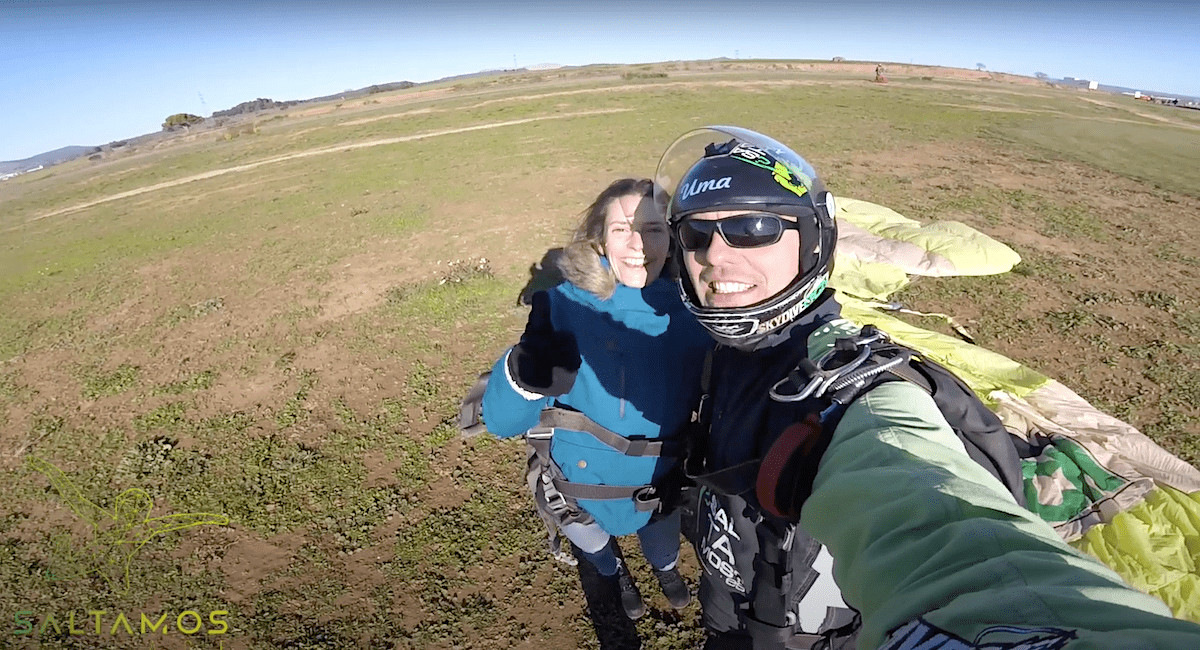 Two people smiling after skydiving in Barcelona