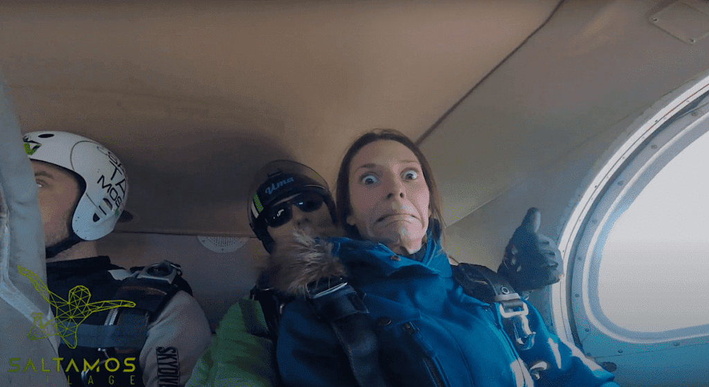 Three people inside the plane before skydiving