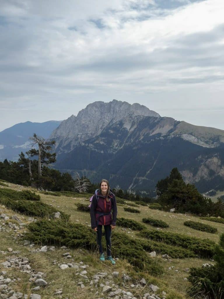 A person standing in front of the Pedraforca mountain