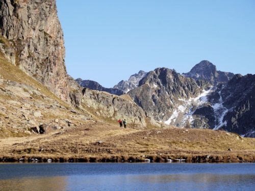 Two people hiking in the mountains of Andorra