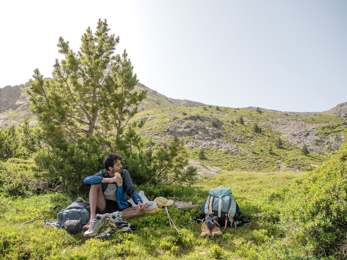 A hiker taking a break during the Coronallacs hike