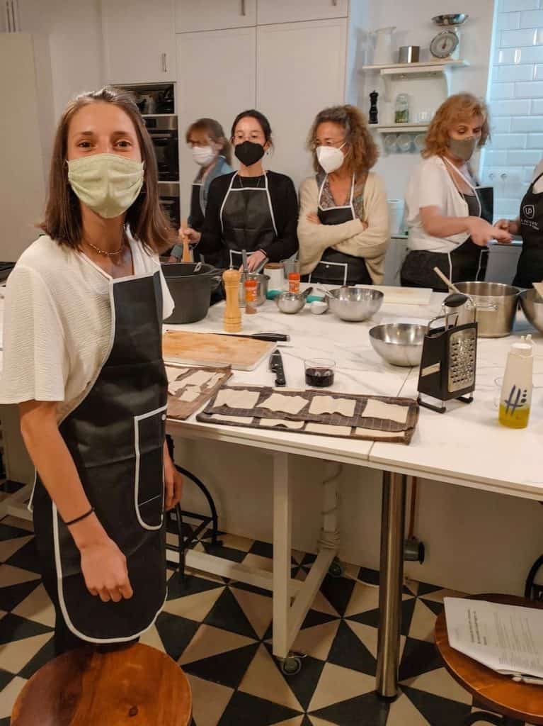 People cooking in a cooking class in Barcelona