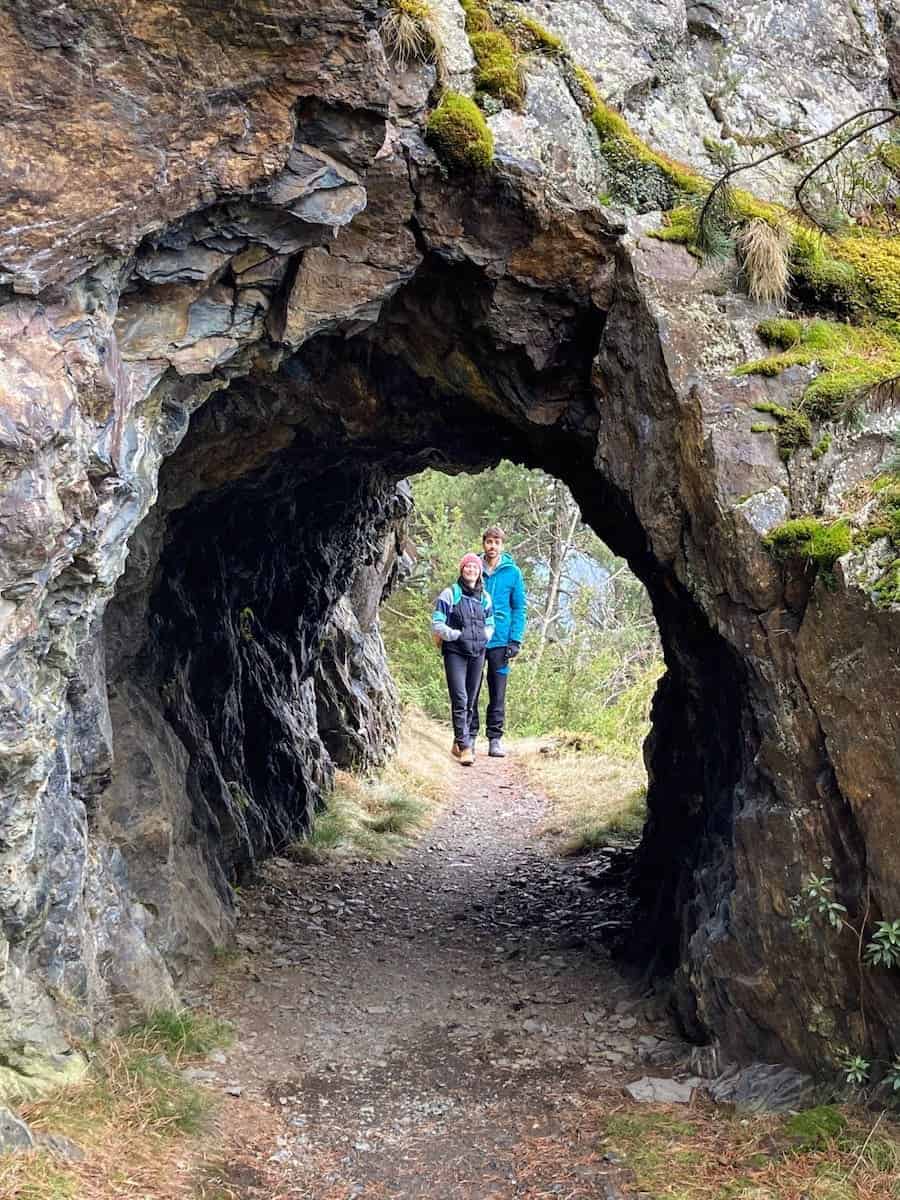Two hikers in a tunnel at Camí del Canal (Andorra)