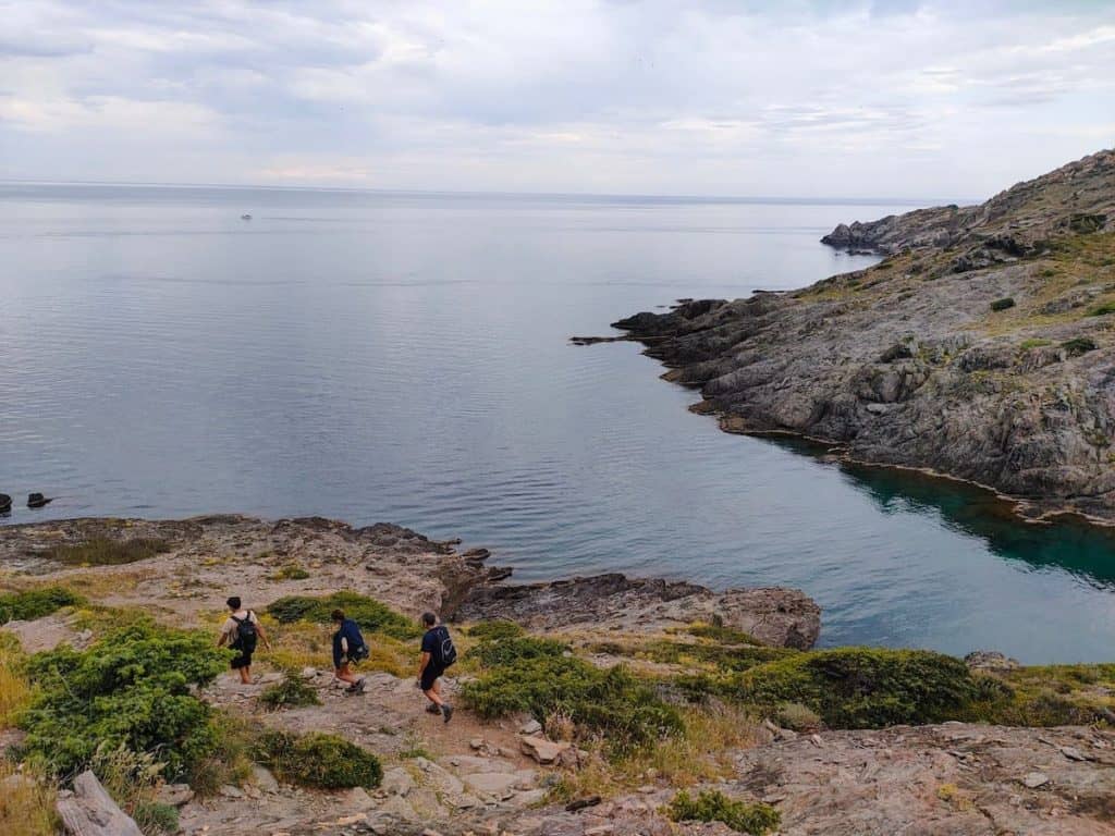 Three people hiking in the Cap de Creus natural park