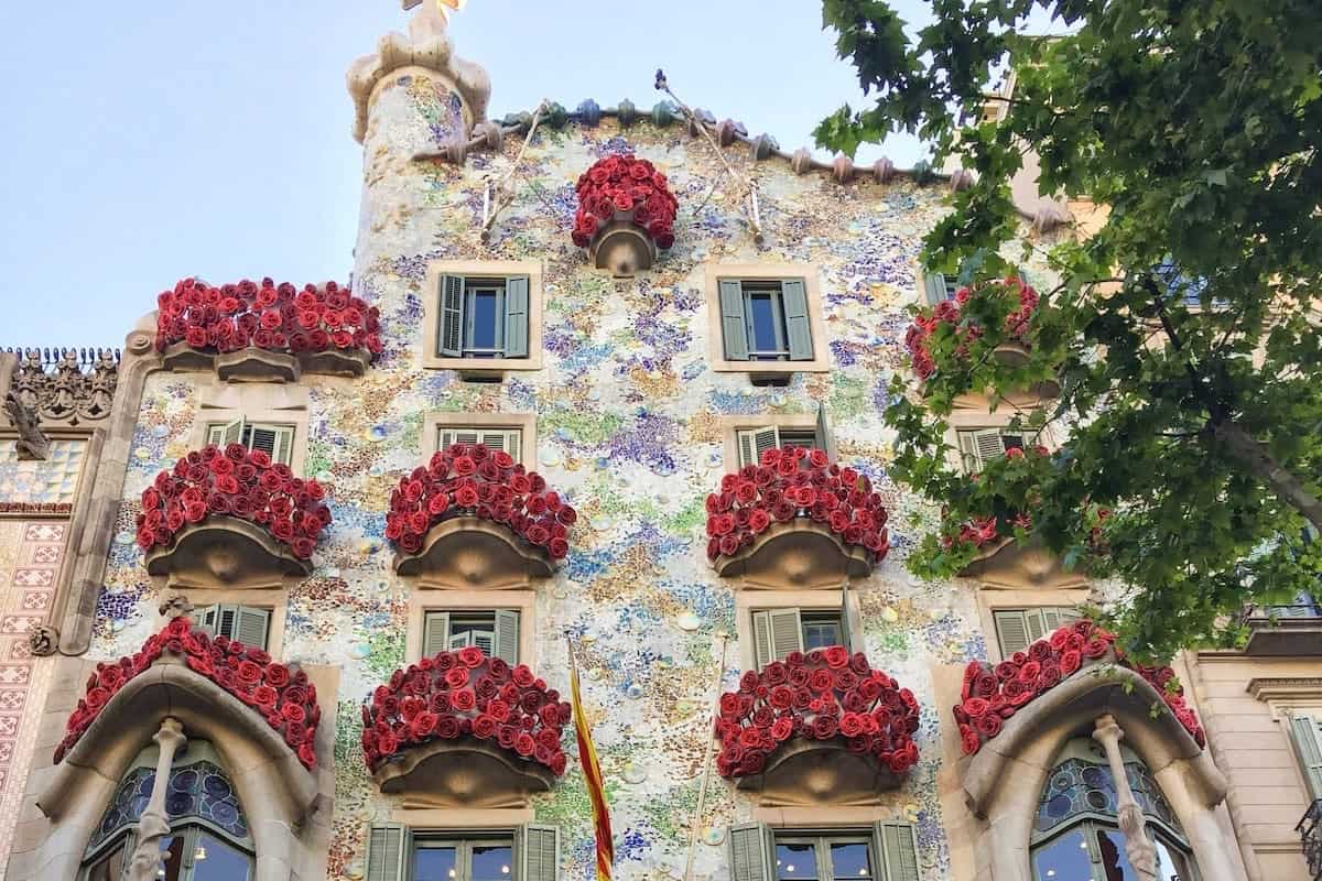 Casa Batlló with the balconies decorated with red roses for Sant Jordi