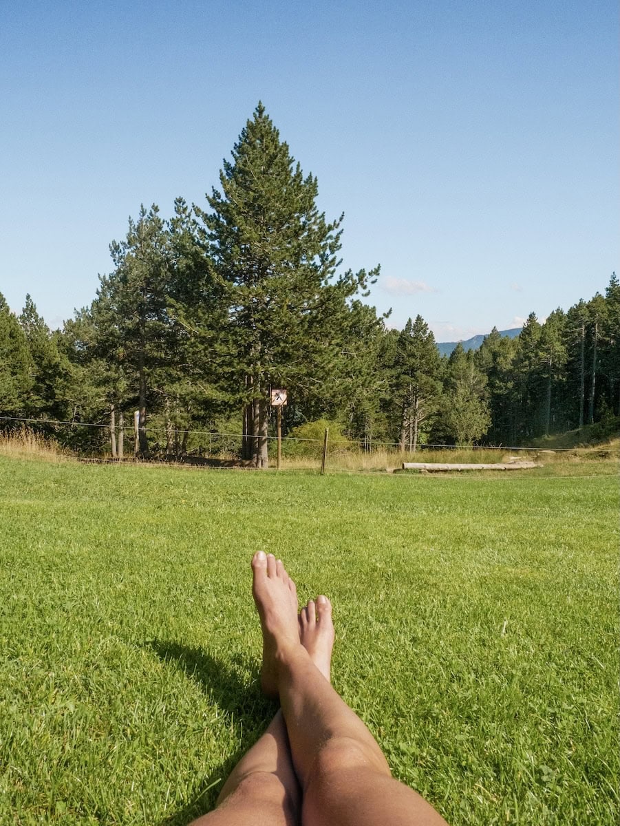 A person chilling in the meadow by Lluis Estasen hut