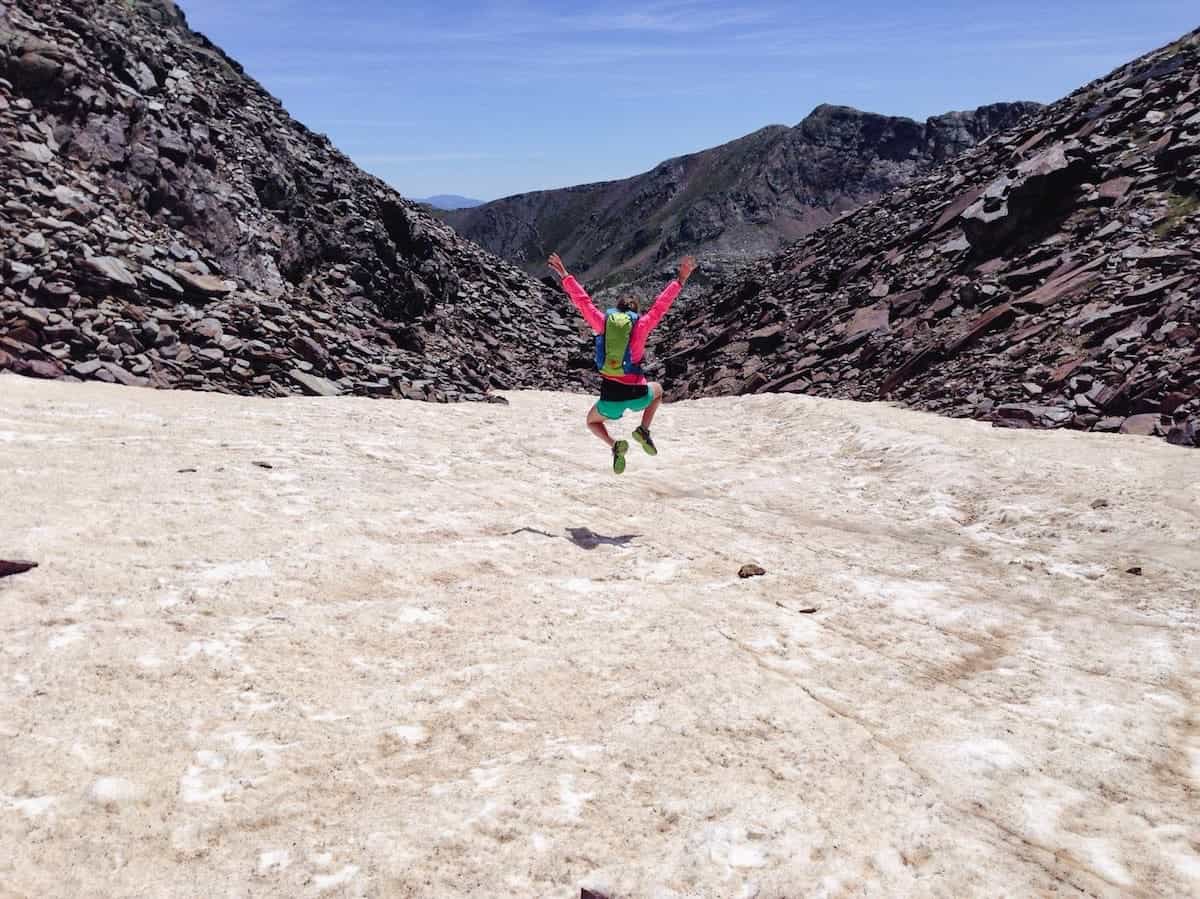 A person jumping in the during the Comapedrosa descent