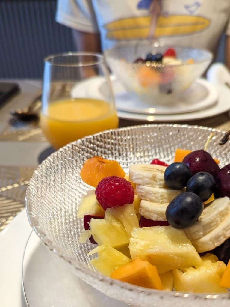Fruit bowl and orange juice for breakfast