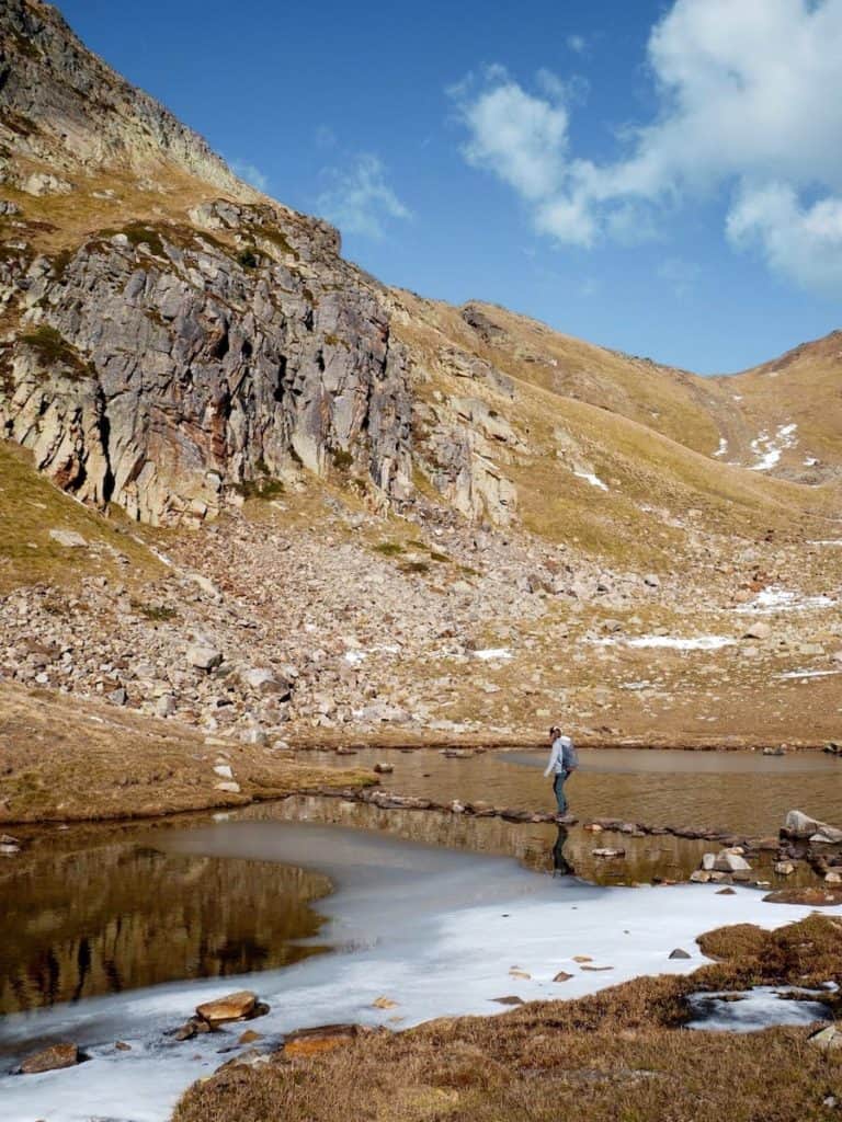 A hiker in l'Estany de l'Isla, in Andorra