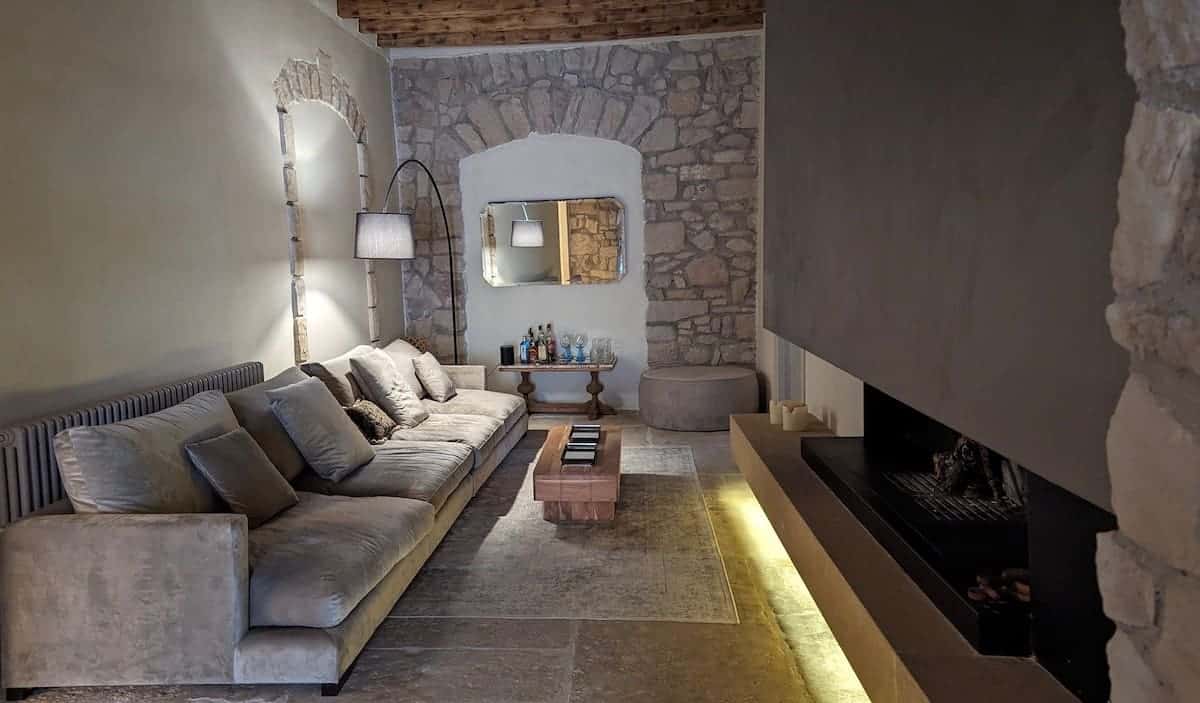 Living room and fireplace in Casa Llobera