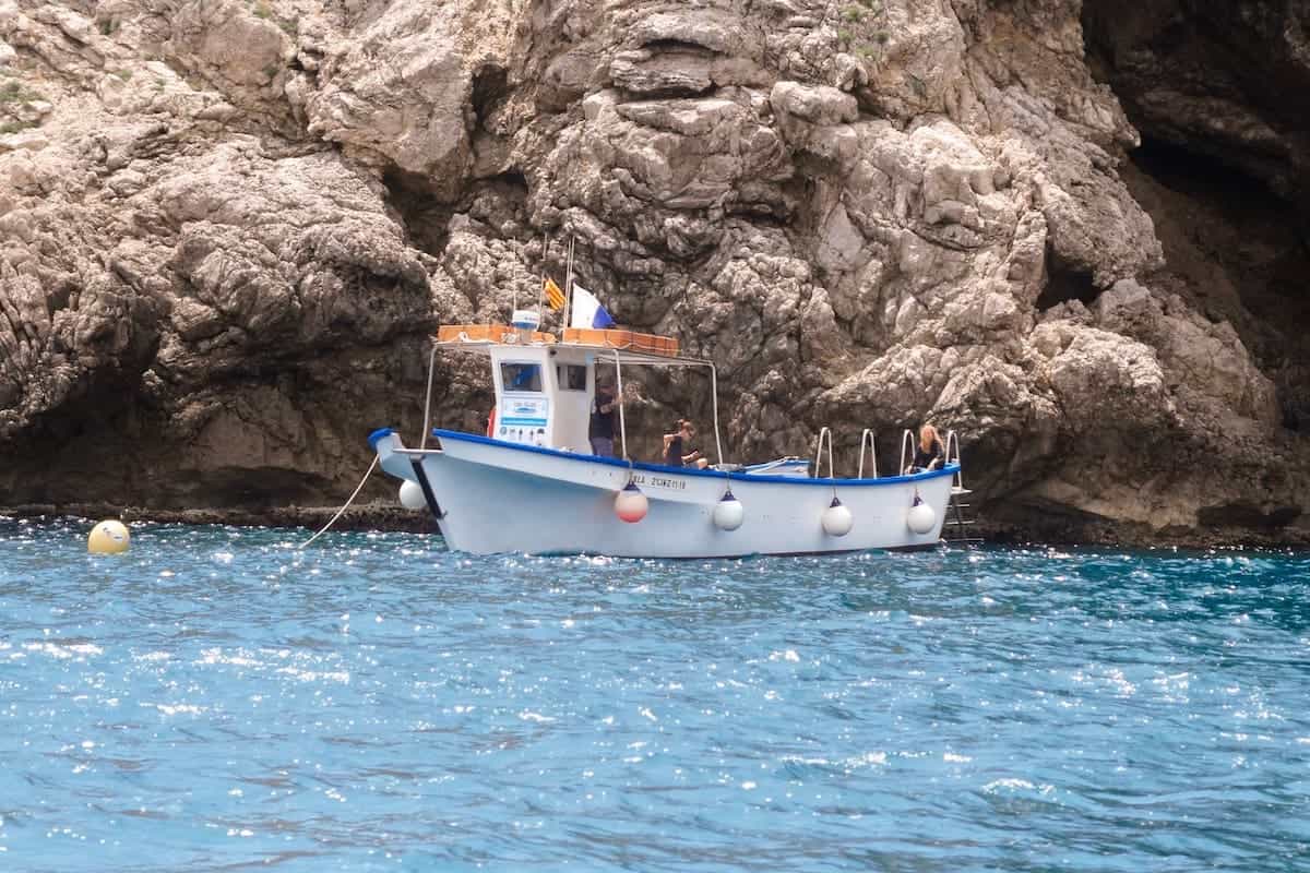 A fisherman's boat navigating around the Medes Islands