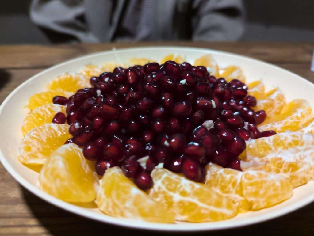 A dish of pomegranate and clementines