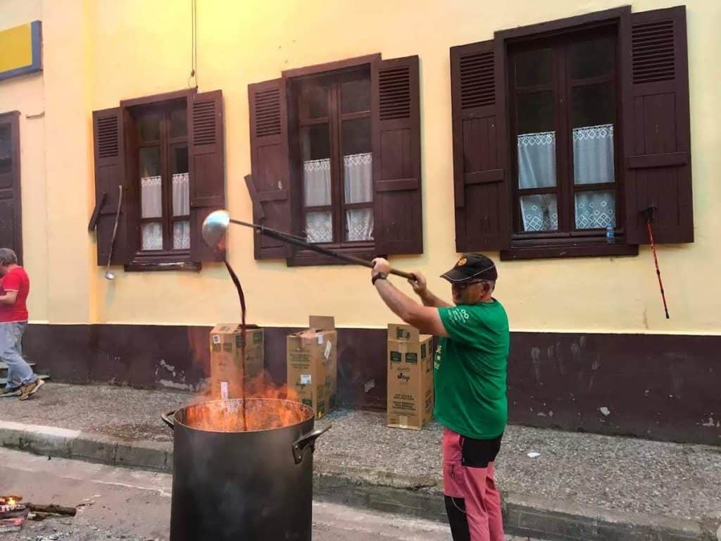 A man warming wine in Val d'Aran
