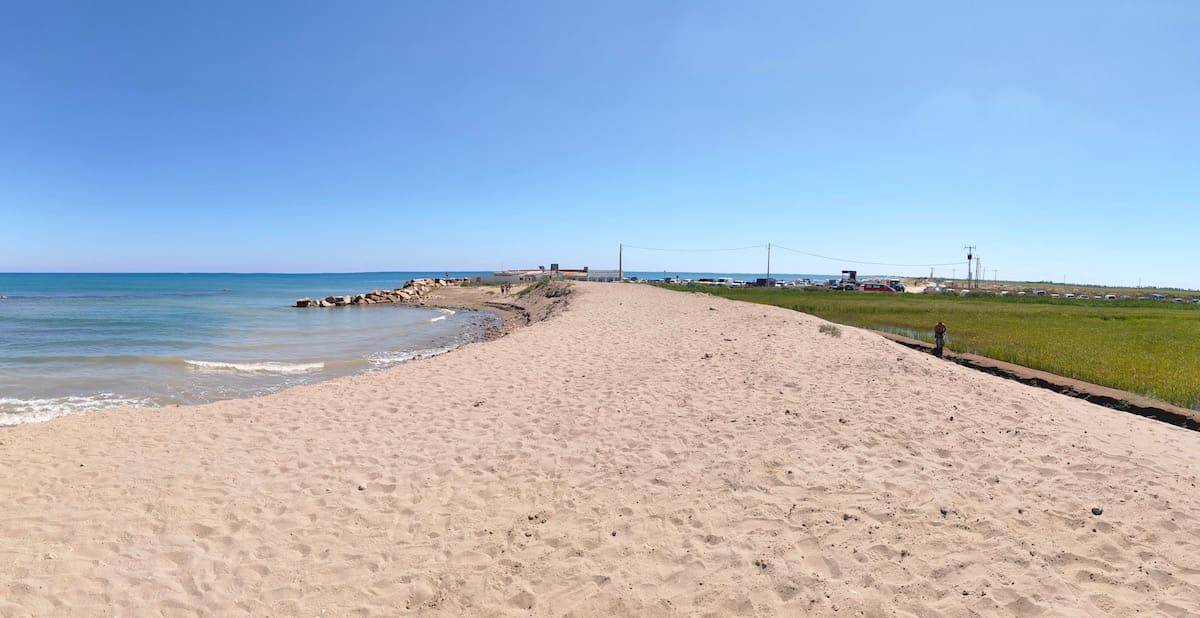 Fangar beach, with the sea on one side and the rice fields on the other