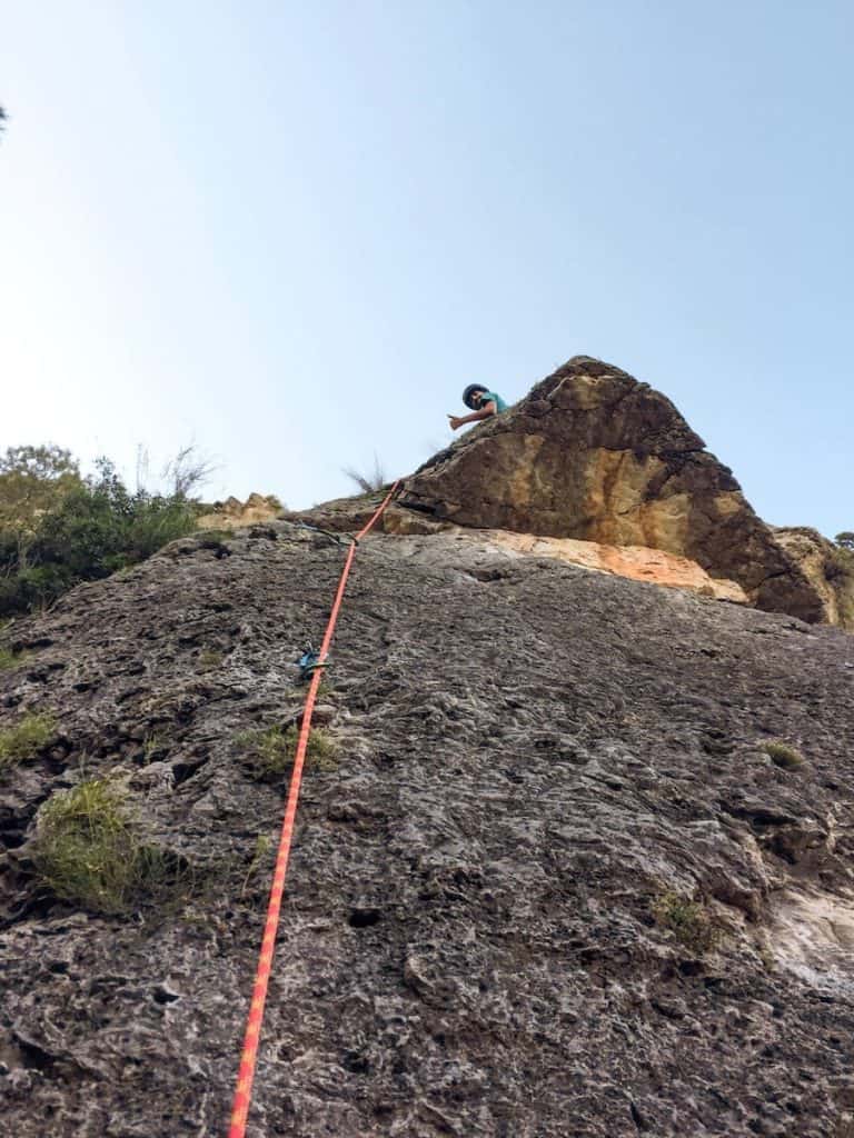 A climber on top of a route in Siurana