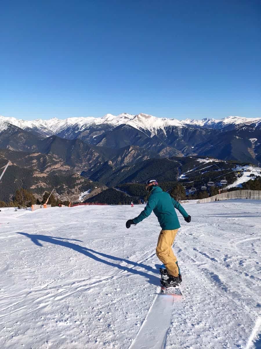 A person snowboarding in one of Andorra's ski resorts