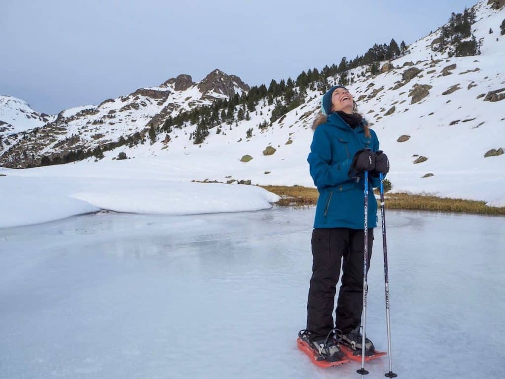 A person standing on a frozen lake in Andorra in winter