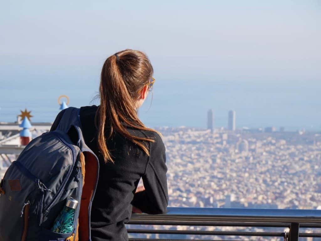 A person enjoying the views of Barcelona from Tibidabo