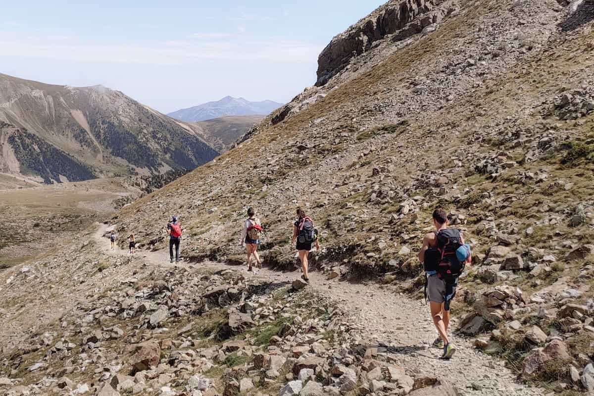 Six hikers walking the Travessa dels 3 Refugis